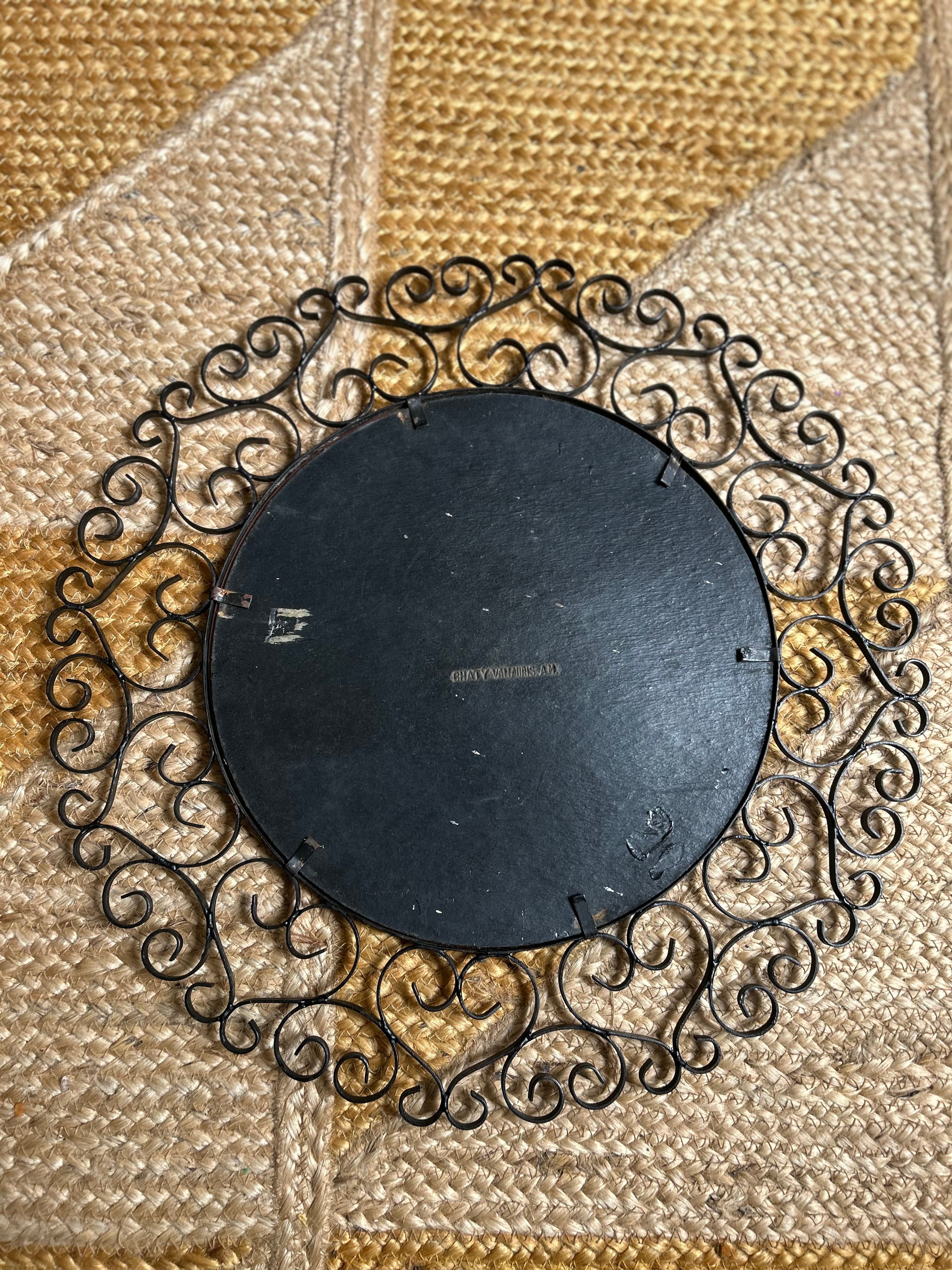 Miroir rond biseauté en fer forgé