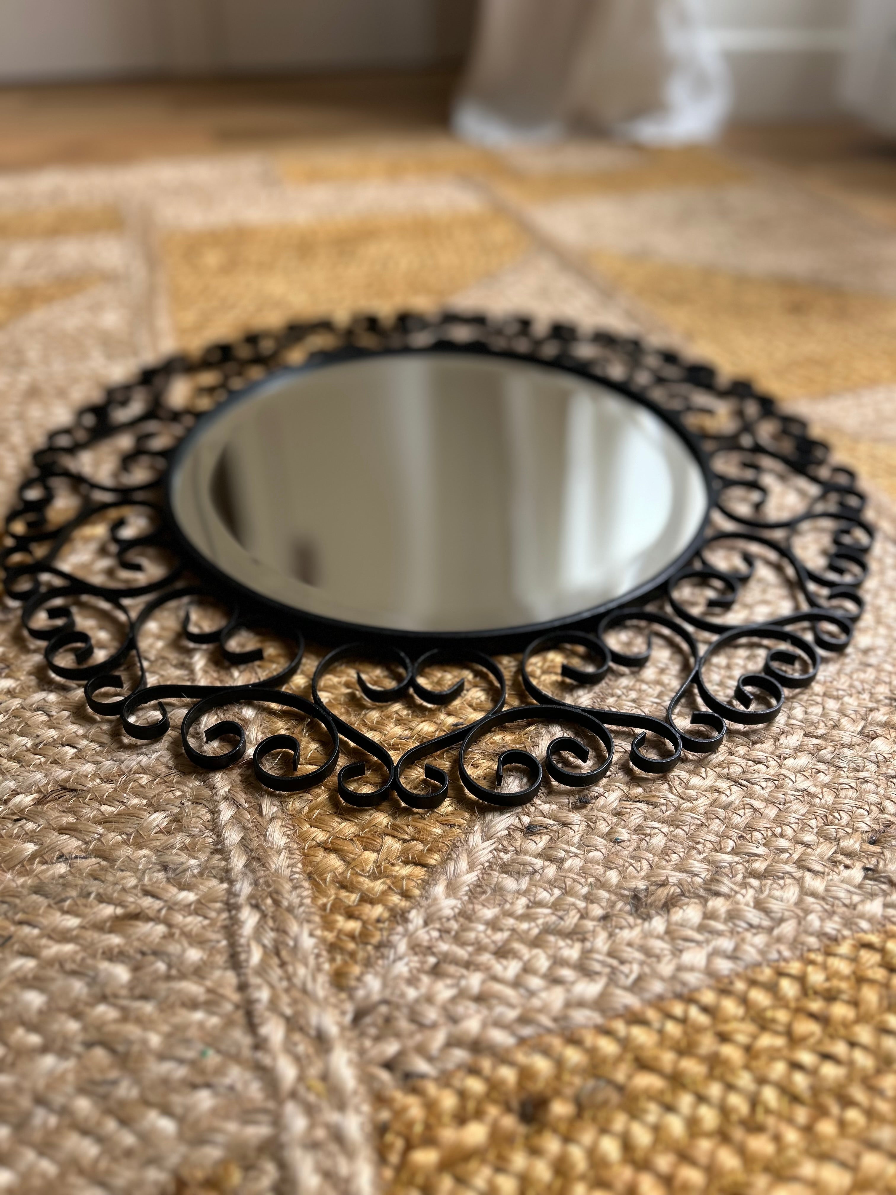 Miroir rond biseauté en fer forgé